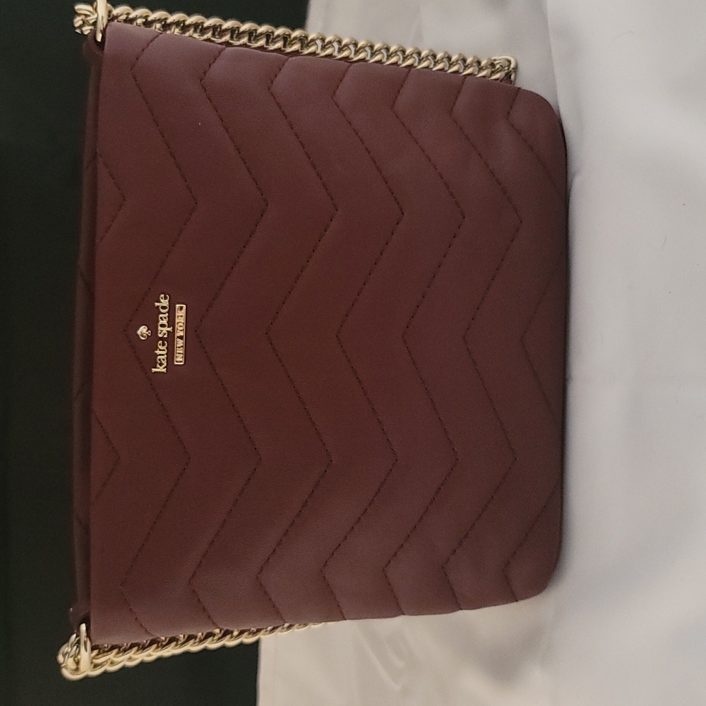 Kate spade crossbody, color burgundy and New without tags.